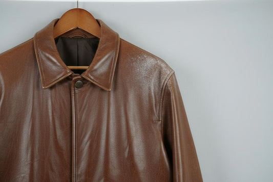 Brown leather jacket with spue on the collar and shoulder.