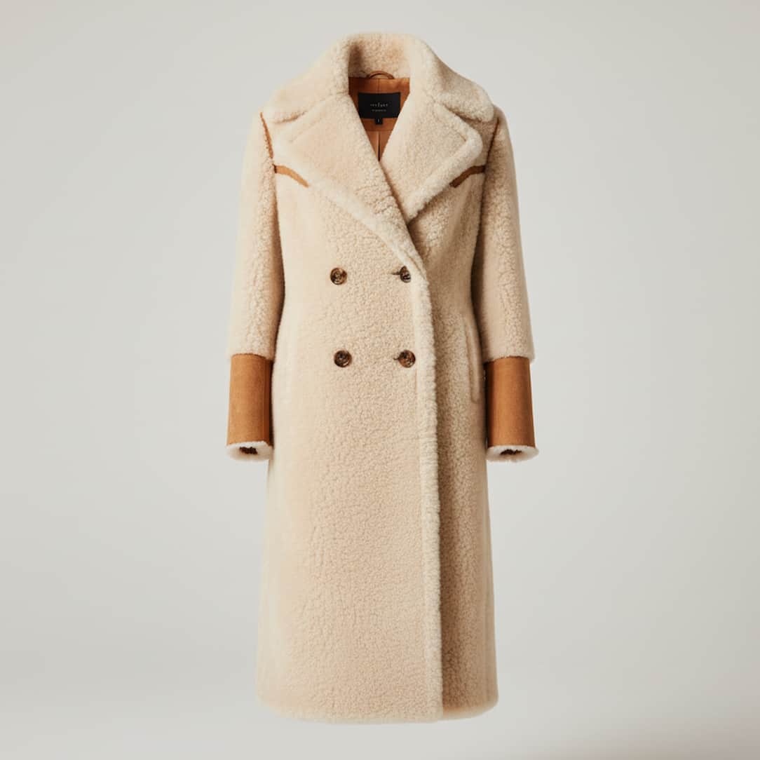 Cream color long fashion shearling coat cleaned at leathercareusa.com