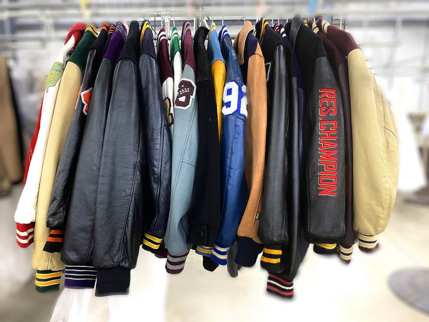 A rack of varsity jackets cleaned at leathercareusa.com