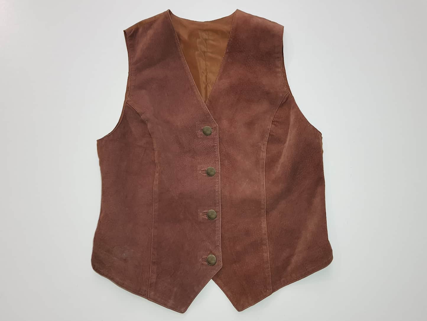 Brown suede vest on a light gray background