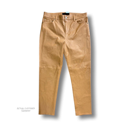 A pair of tan leather pants cleaned at LeathercareUSA.com