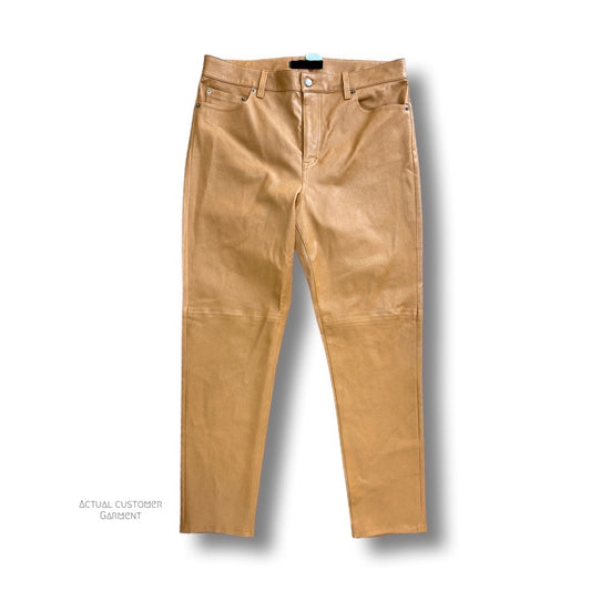 A pair of tan leather pants cleaned at LeathercareUSA.com